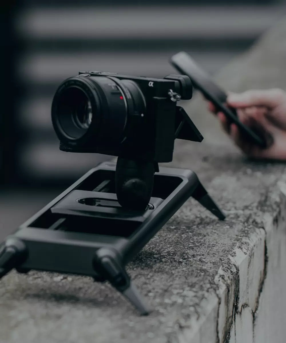 a motorized camera slider being controlled with a phone